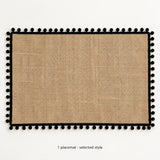 One black pom-pom trimmed placemat, selected style; 30 x 45 cm.