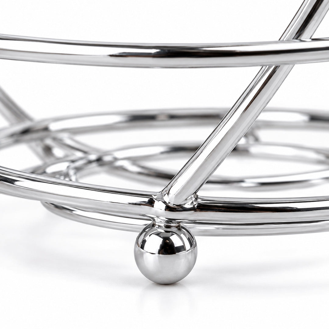 Close-up of chrome-finished wire construction and a small ball foot.