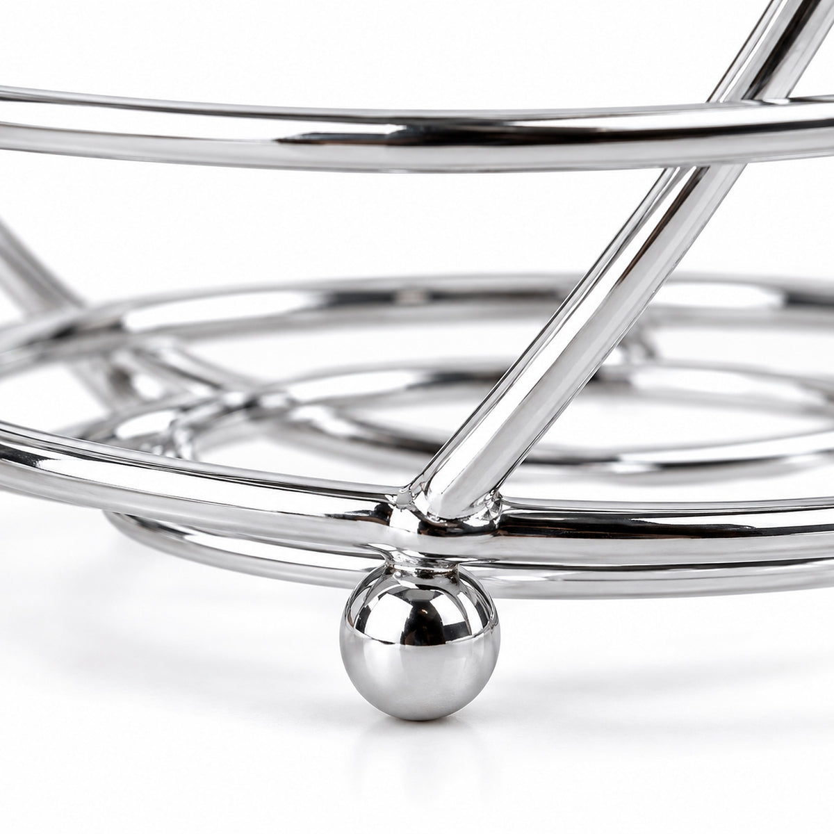 Close-up of chrome-finished wire construction and a small ball foot.