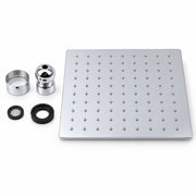 A square stainless steel rain shower head plate with multiple nozzles, shown alongside mounting hardware including a chrome adapter, a filter screen, and two black rubber gaskets on a clean white background.