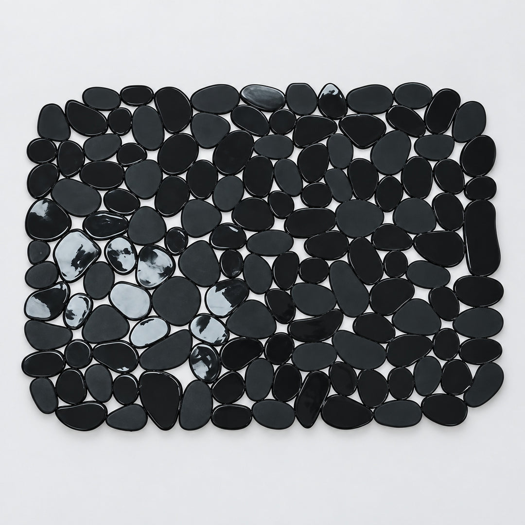 A rectangular arrangement of glossy black pebble-shaped tiles or stones on a plain white background.