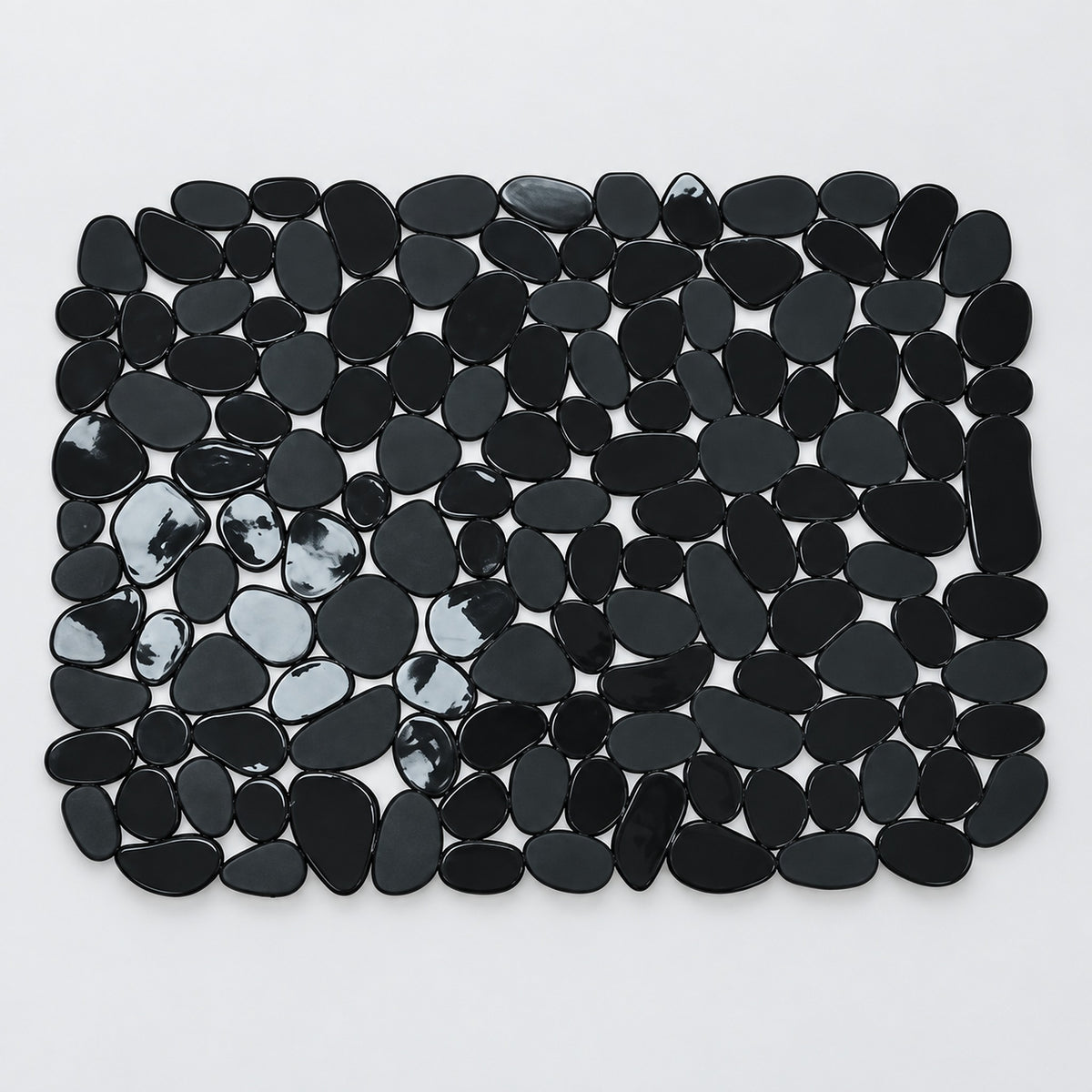 A rectangular arrangement of glossy black pebble-shaped tiles or stones on a plain white background.