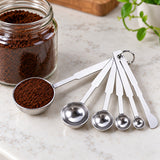Measuring spoon used to portion coffee; five-spoon set includes a flat leveler.