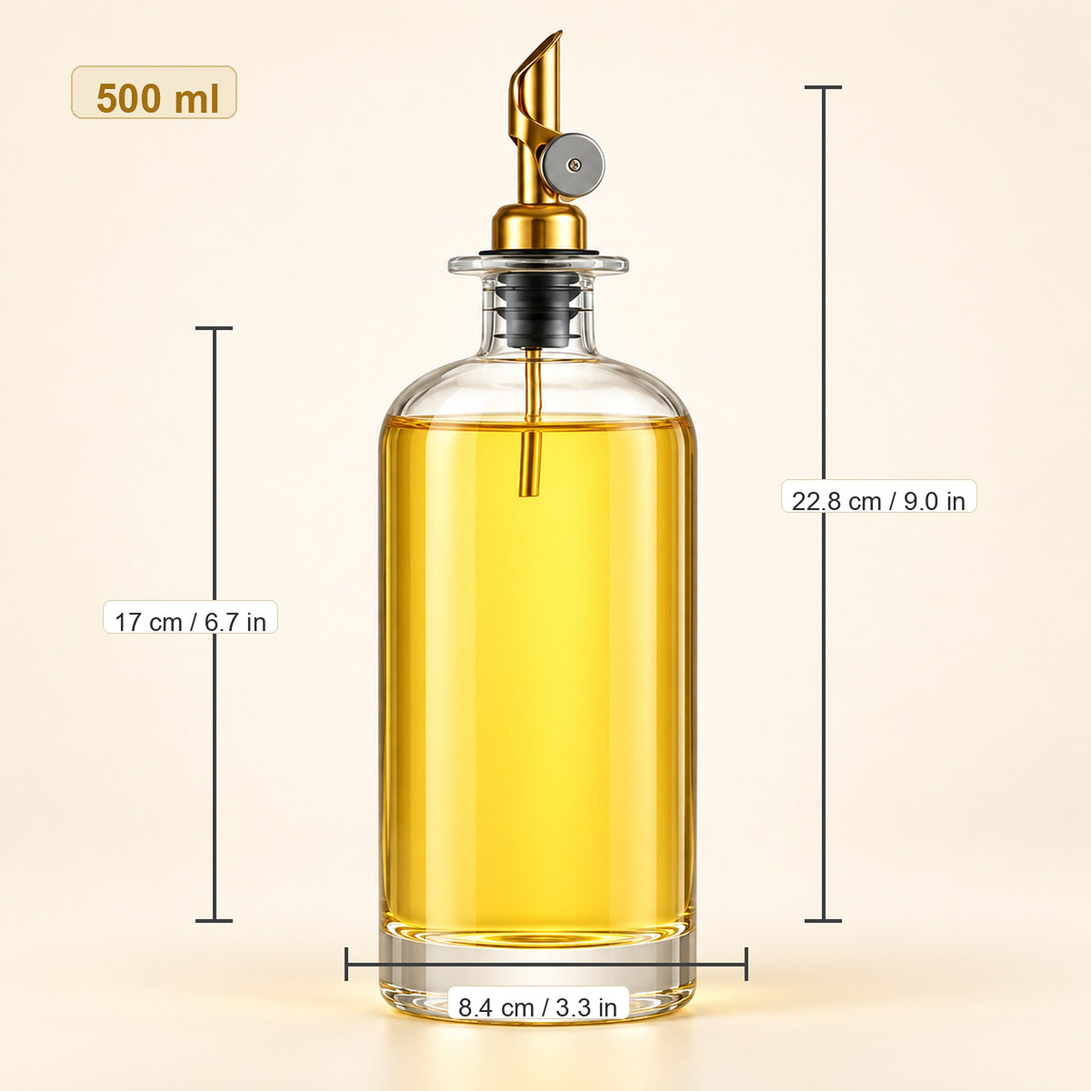 A 500 ml clear glass oil dispenser bottle filled with golden yellow oil, featuring a gold-toned metal pour spout and black collar. The image includes dimension lines and text showing the bottle's height (22.