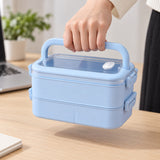 Blue two-layer bento lunchbox carried by its folding handle.