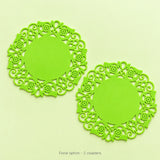 Two lime-green floral round coasters, sold as a pair.