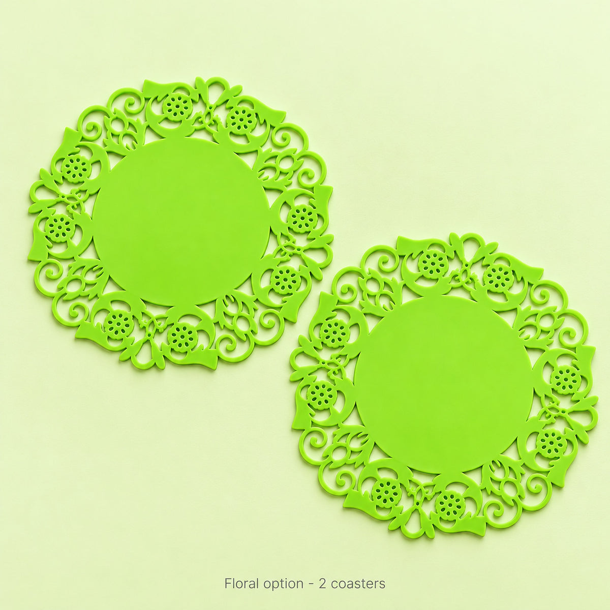 Two lime-green floral round coasters, sold as a pair.