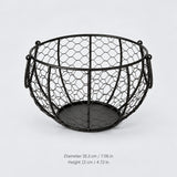 Black wire egg basket, 19.2 cm wide and 12 cm high.
