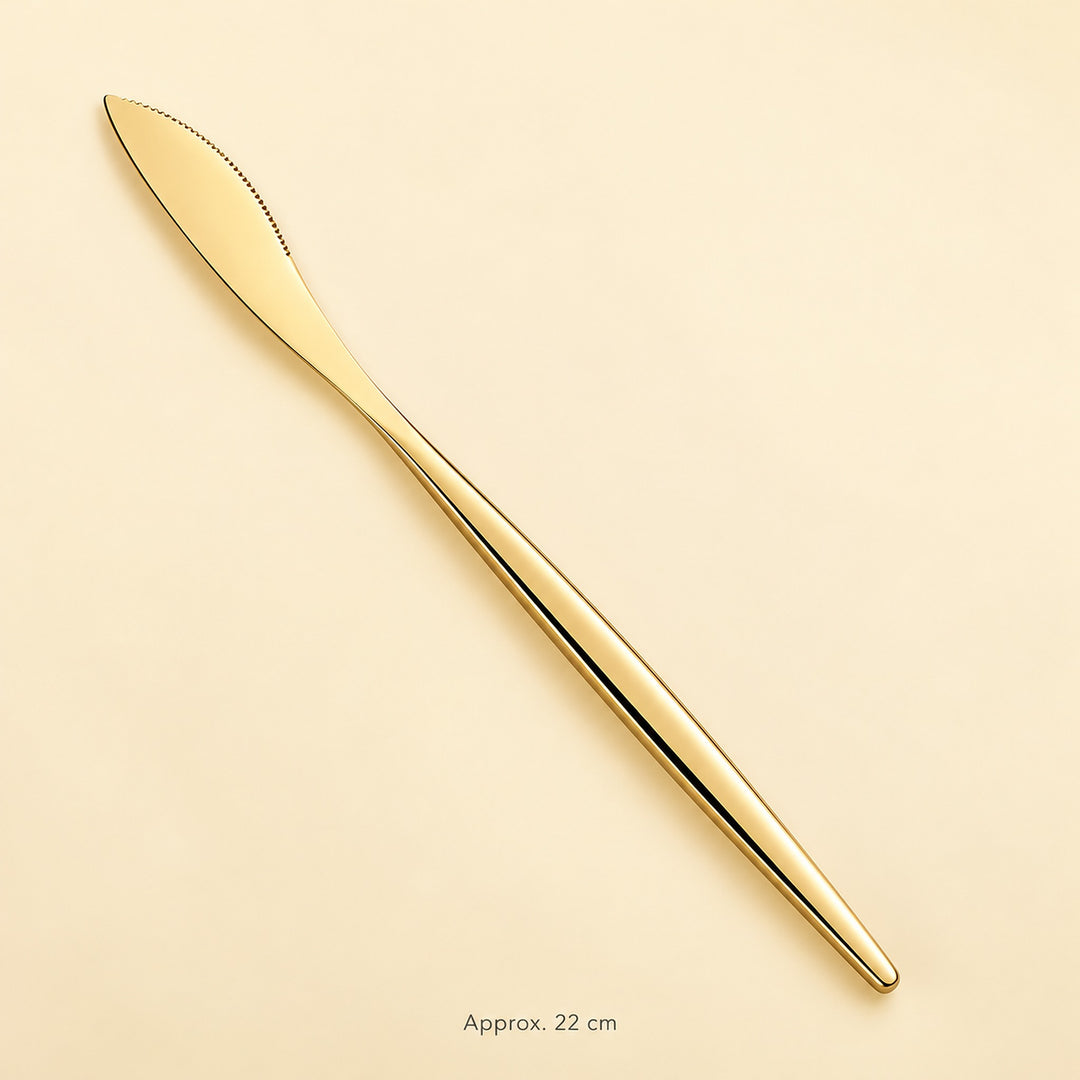 Gold dinner knife, approximately 22 cm long.
