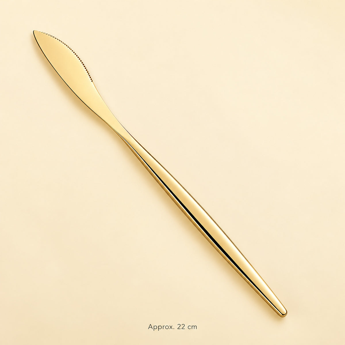 Gold dinner knife, approximately 22 cm long.