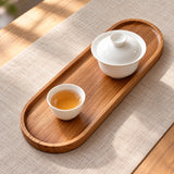 Large oval tray holding tea vessels; teaware not included.