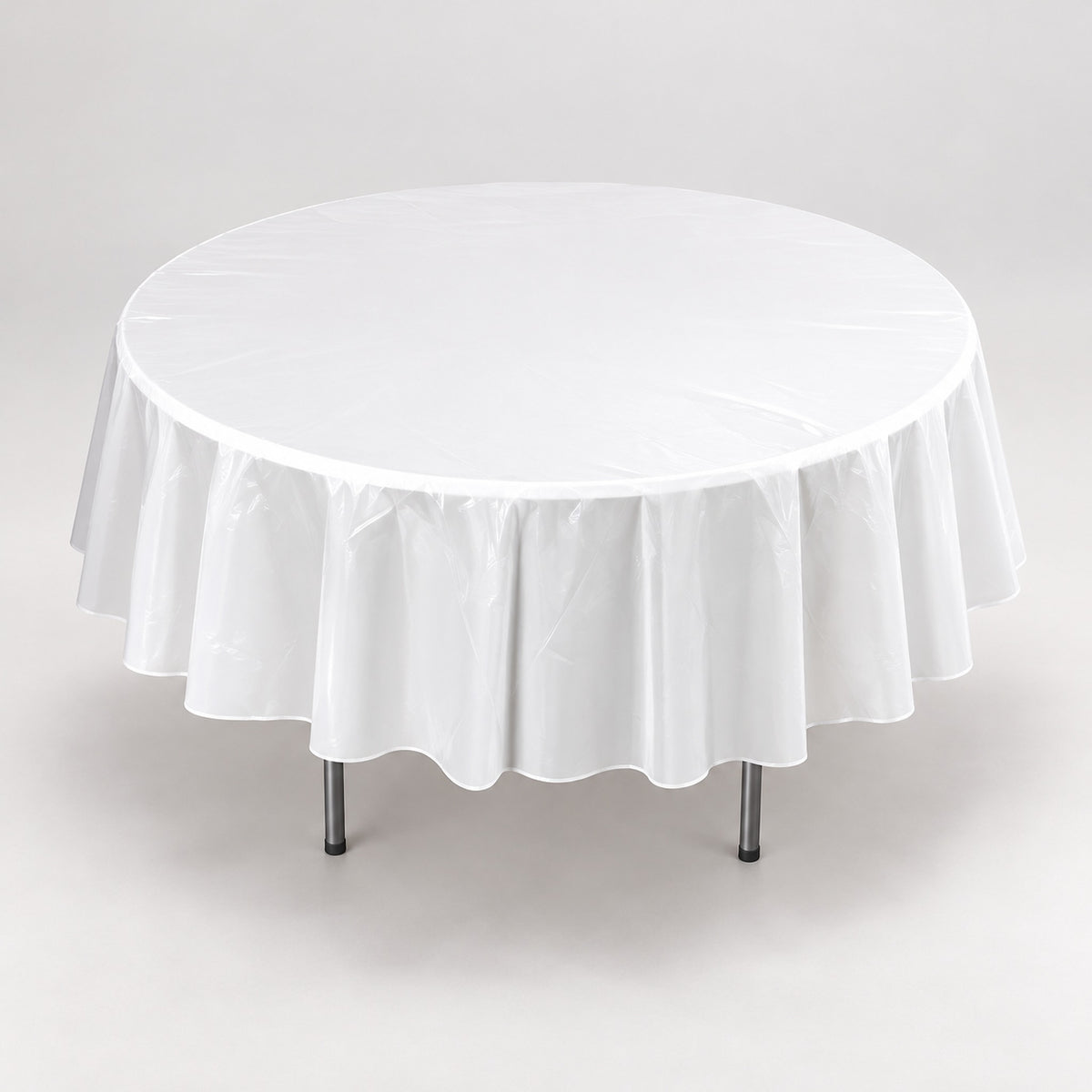 White disposable tablecloth with round edge and hanging drape.