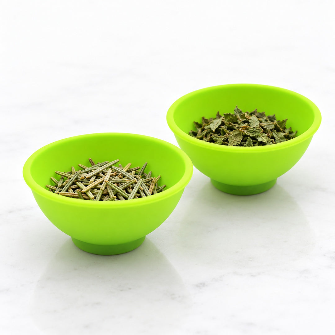 Two mini silicone bowls keeping dried herbs separate.