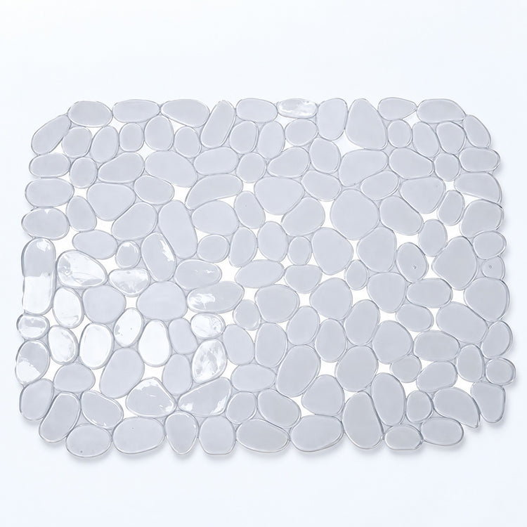 A rectangular bath mat made of smooth, rounded pebble-shaped tiles in translucent white and light gray, shown from a top-down view on a white background.