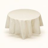 One beige disposable PVC tablecloth draped over a round table.