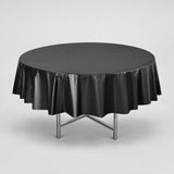 One black disposable PVC tablecloth draped over a round table.