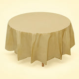 One gold disposable PVC tablecloth draped over a round table.