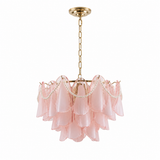A modern chandelier featuring a gold-finished metal frame, chain, and ceiling canopy, with layered blush pink glass shades and delicate pearl bead garlands.