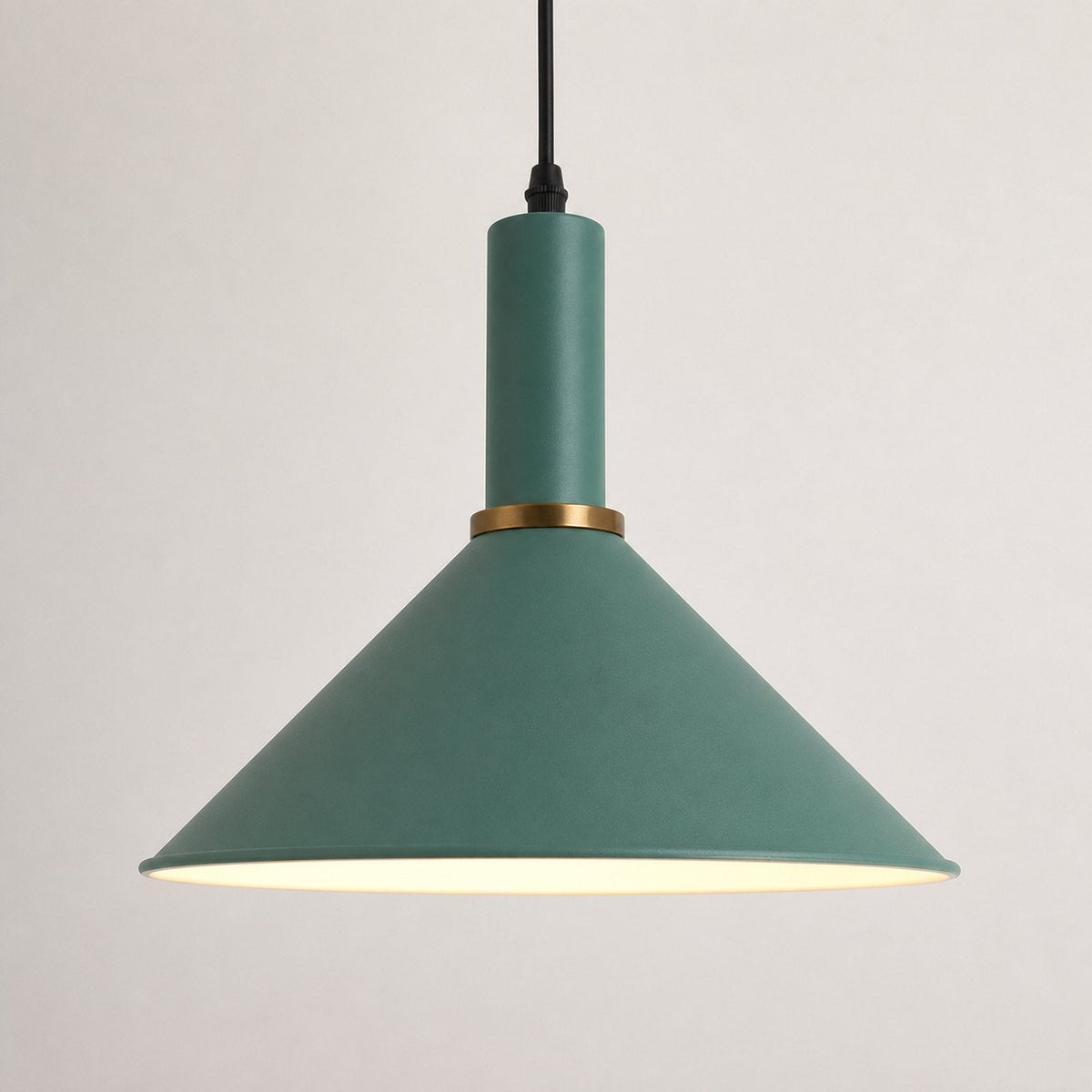A modern pendant light with a matte sage green conical shade, a matching cylindrical neck, a gold metal accent ring, and a black hanging cord, shown against a plain light gray background.