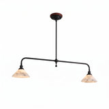 Two-light linear pendant light with a dark frame and illuminated cream alabaster shades against a white background.