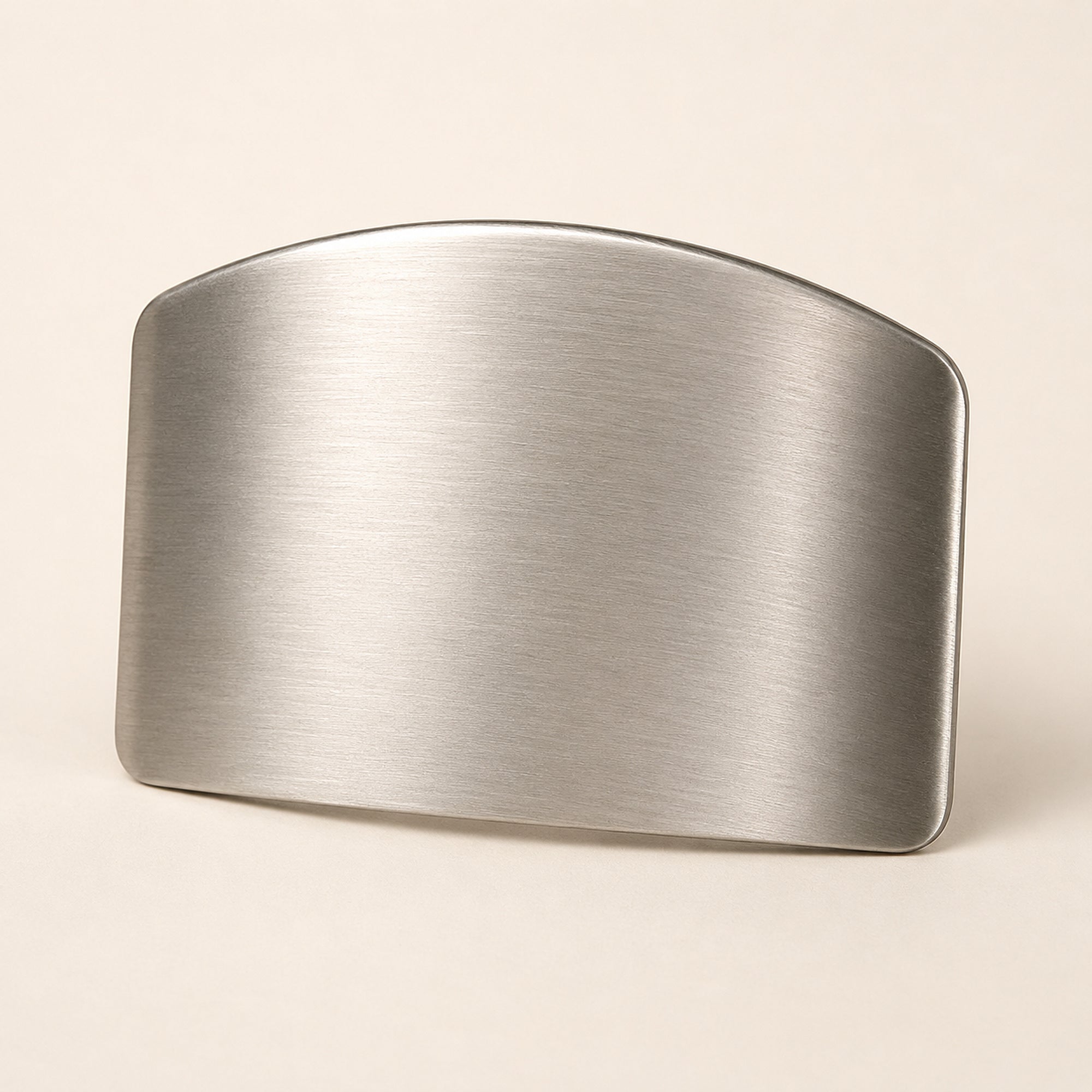 Stainless steel finger guard on a plain background, showing the brushed curved hood and rounded edge