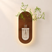 Design C terracotta capsule panel with a cream holder and glass tube, lit