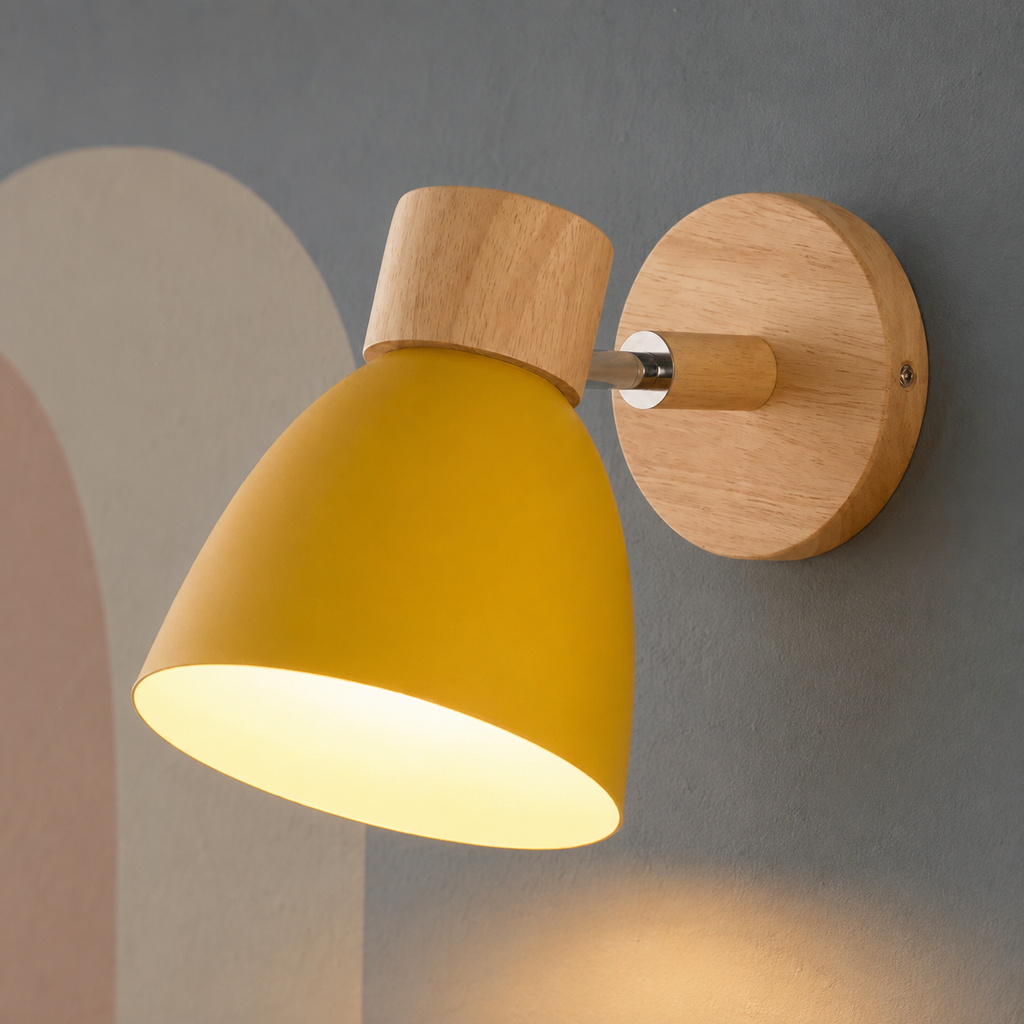 Yellow bell wall lamp with wood cap lit warm on a slate wall with pastel arch