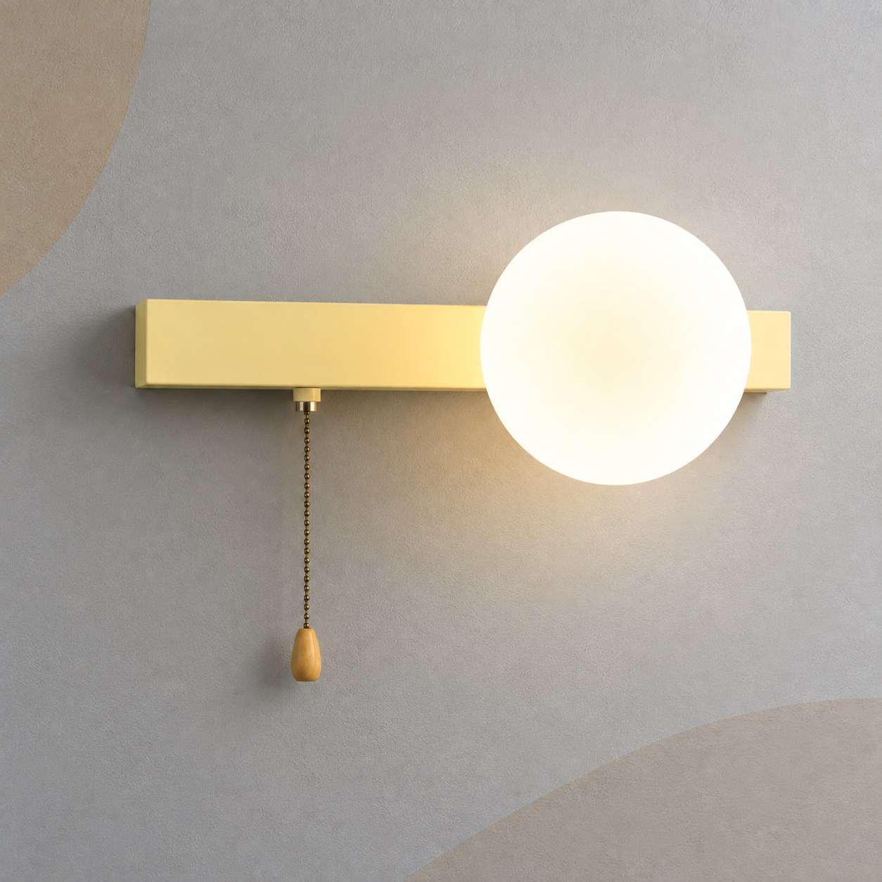 Soft beige bar globe wall sconce lit warm with pull chain switch