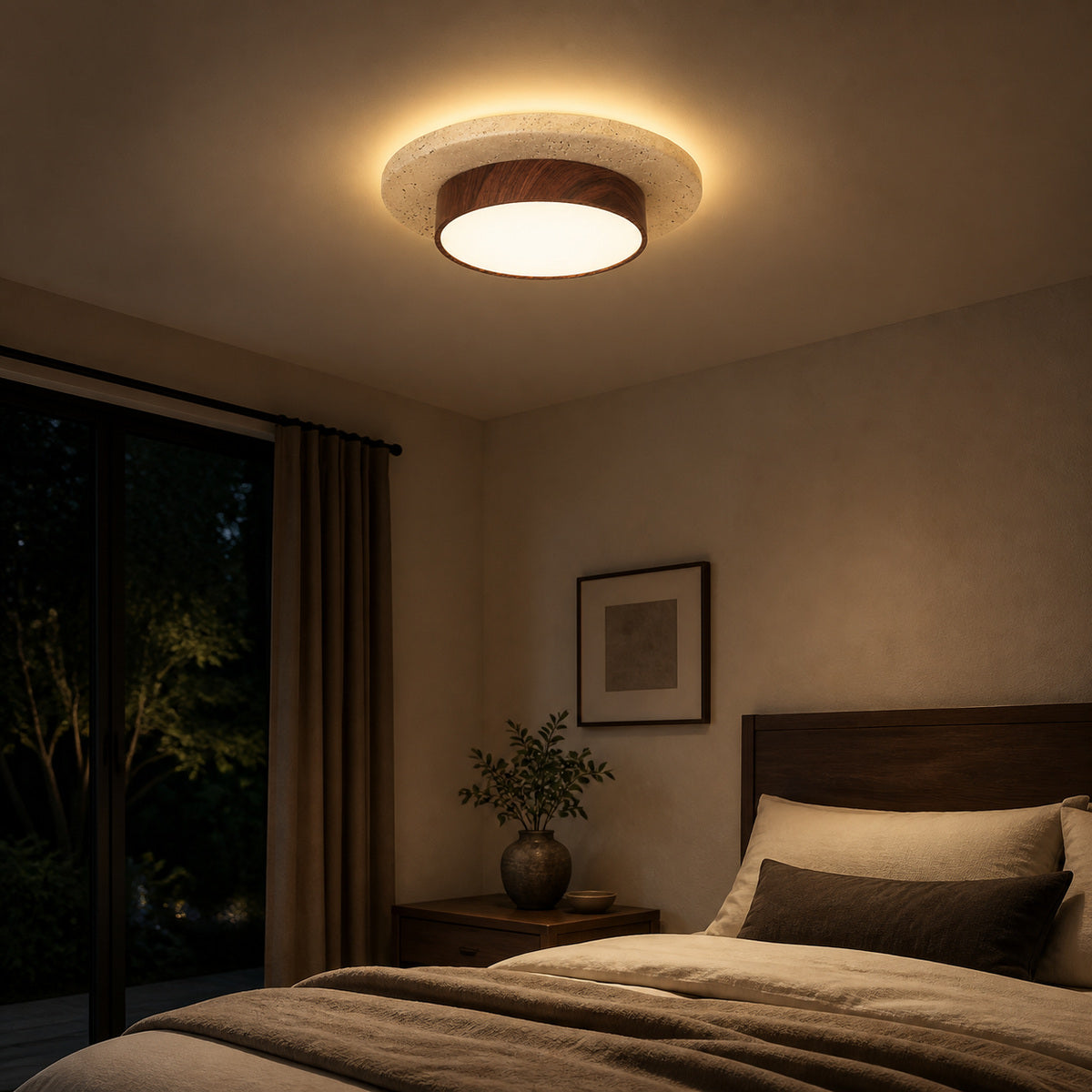 Walnut travertine flush mount ceiling light glowing in a bedroom at night
