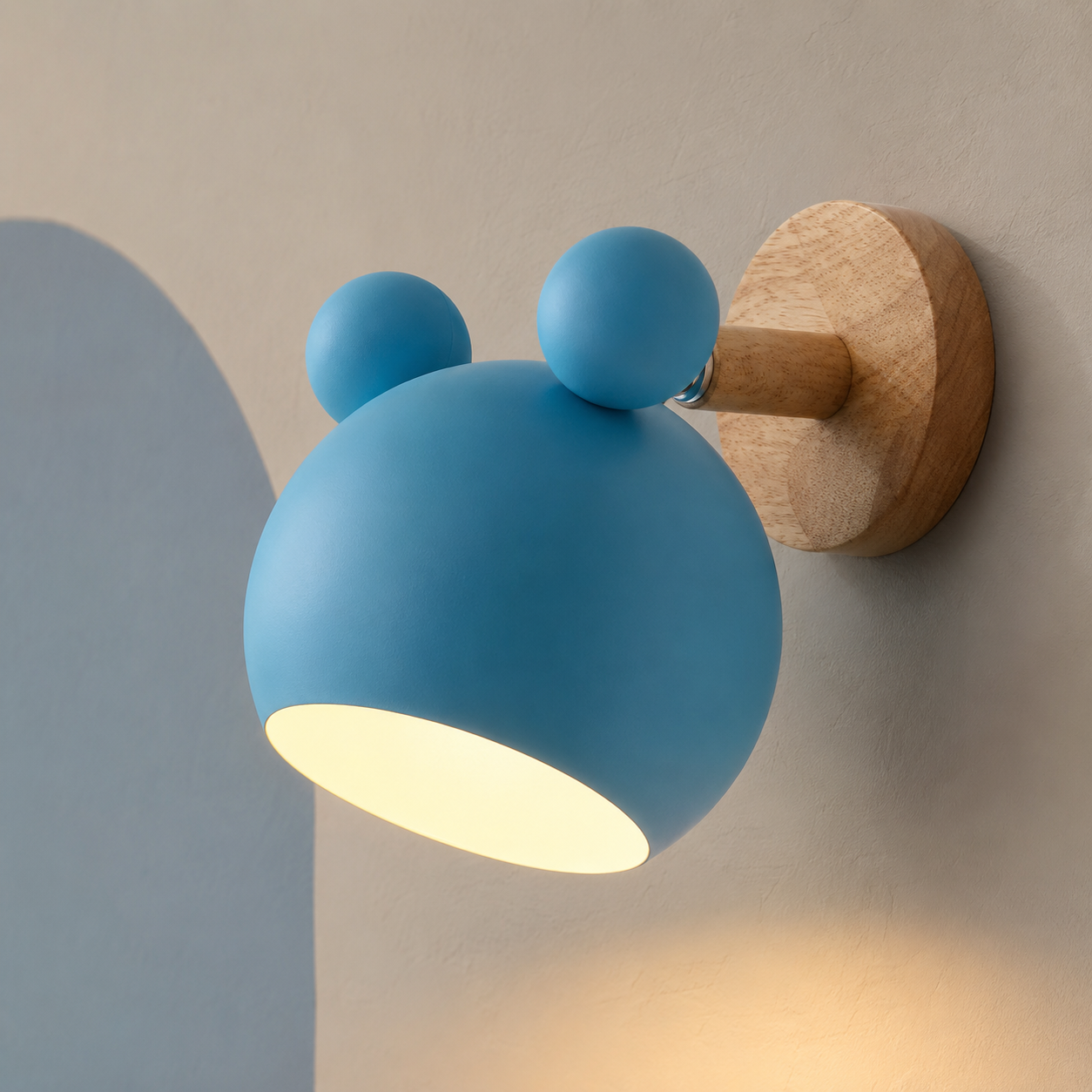 Blue childrens wall lamp glowing warm on a putty wall with powder blue arch
