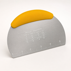 Bench scraper with a yellow handle, brushed stainless steel blade with an etched inch ruler
