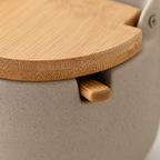 Macro detail of the bamboo lid's integrated spoon slot
