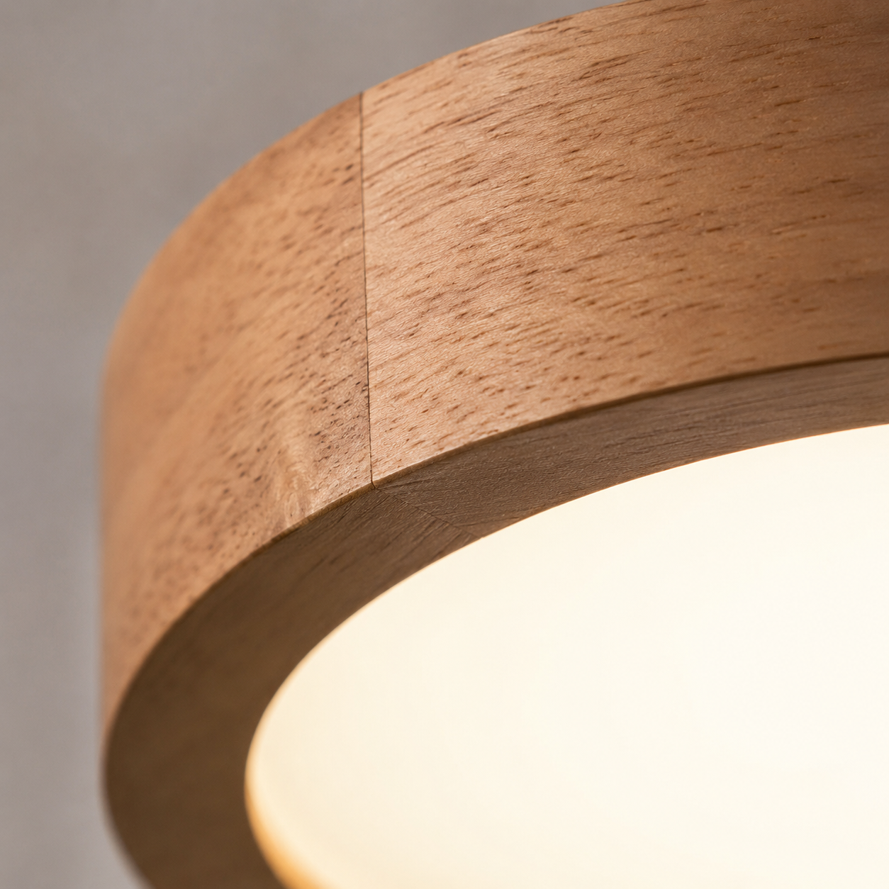 Macro detail of the wood grain and joined seam at the diffuser edge
