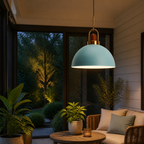 Colorful metal pendant light glowing in a dry covered porch with plants