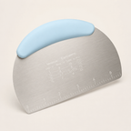 Bench scraper with a pale blue handle, brushed stainless steel blade with an etched inch ruler