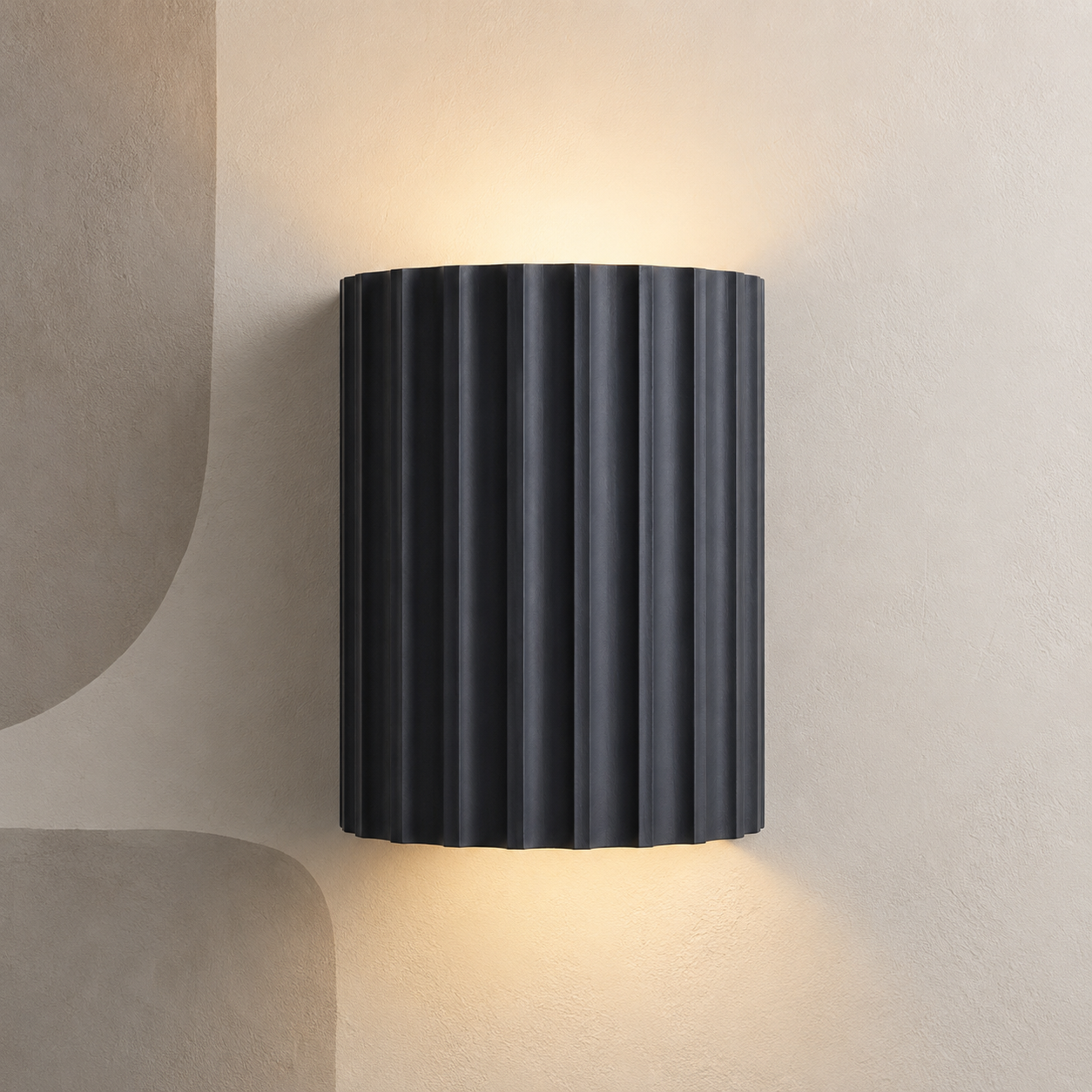 Dark charcoal fluted up down wall light on a stone wall