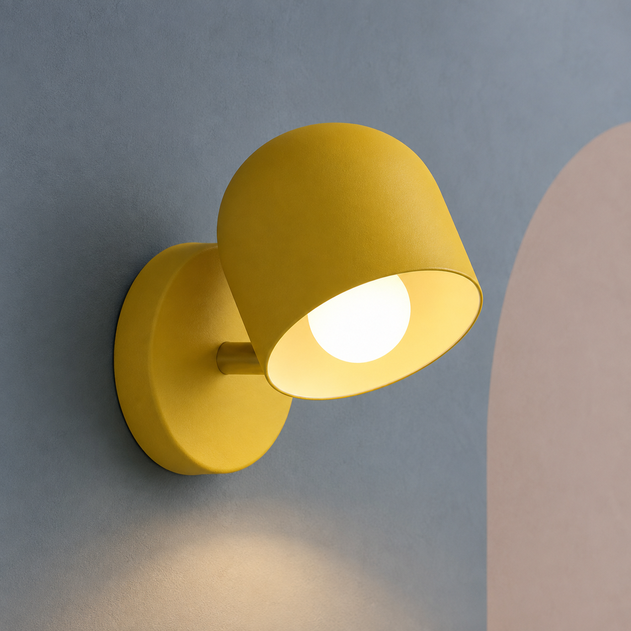 Yellow dome wall sconce lit warm on a slate blue wall