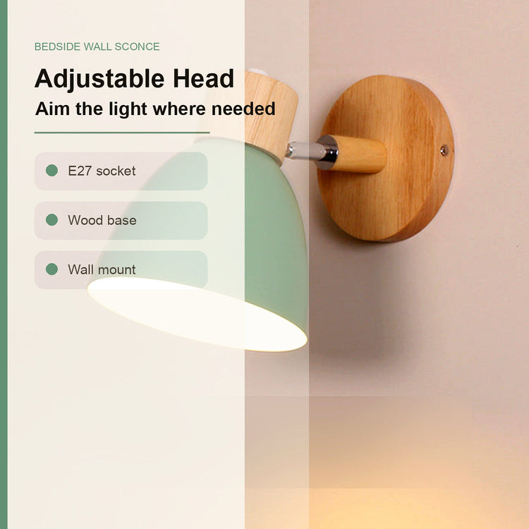 Adjustable bedside wall sconce with a light green shade, wooden base and socket, mounted on a beige wall. The image includes text overlays describing features like 'Adjustable Head', 'Aim the light where needed', 'E27 socket', 'Wood base', and 'Wall mount'.