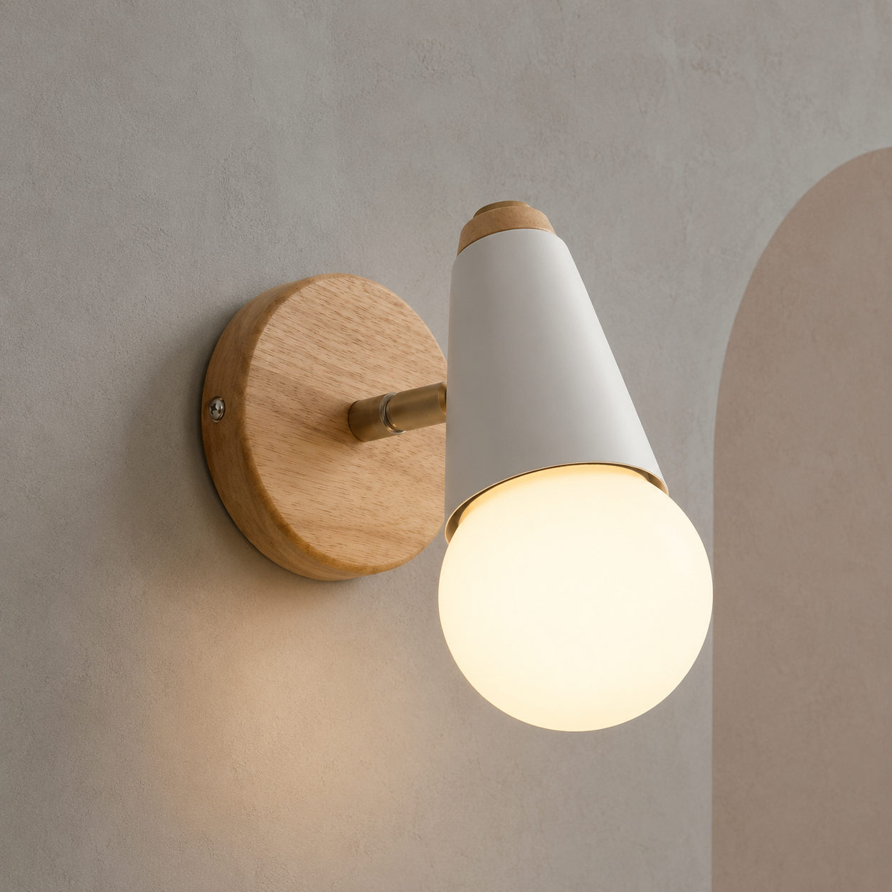 White wall sconce with wood backplate lit on a plaster wall