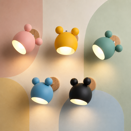 Five lit macaron colors of the bear nursery wall sconce glowing warm on a pastel color-block wall