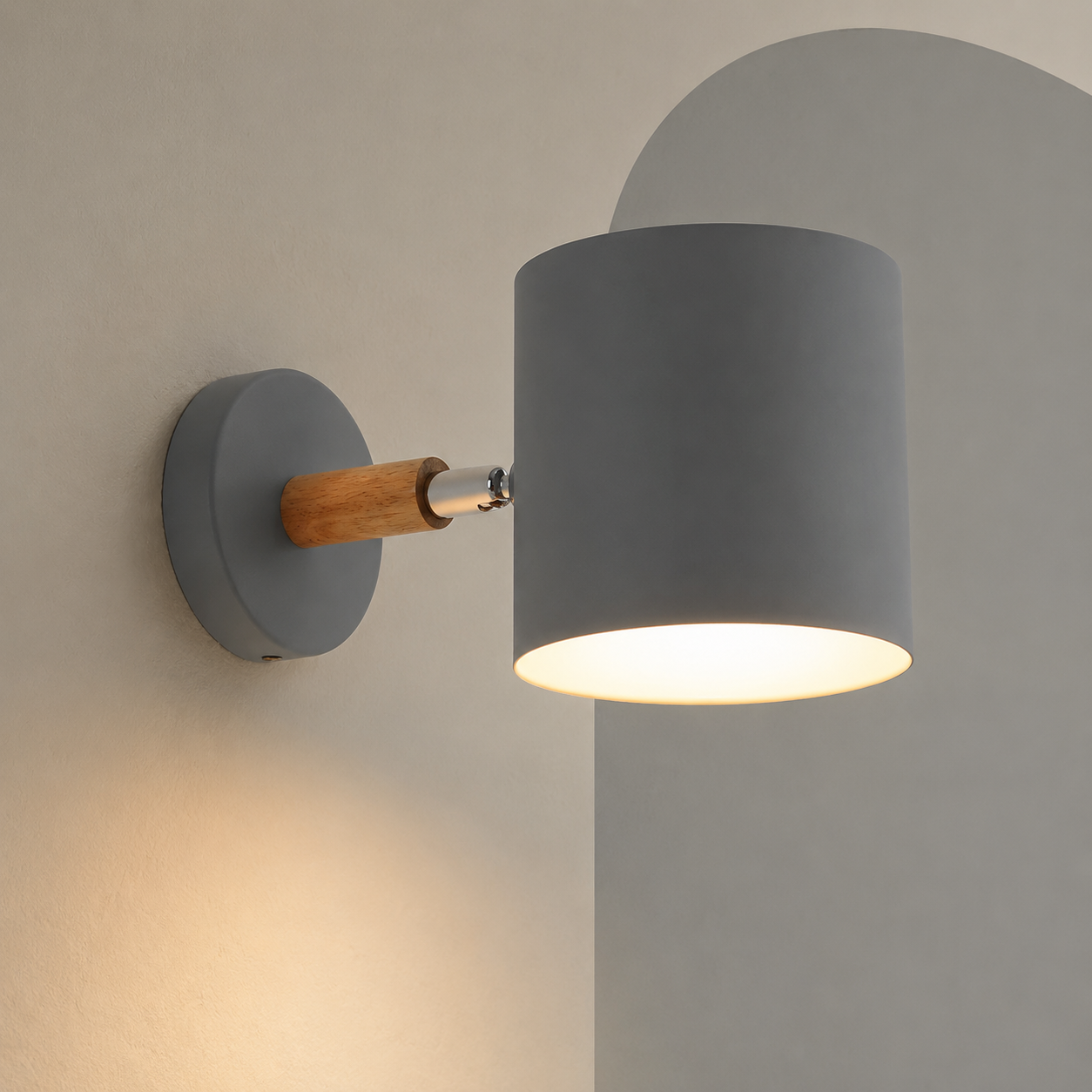 Gray cylinder wall lamp on wood arm lit on a mushroom wall