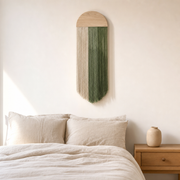 Arched Board Cord Hanging, 30 x 85 cm, 3 Colors hung on the wall above a bed