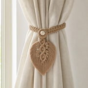 Macrame Leaf Curtain Tieback, 40 x 13 cm, 4 Colors wrapped around a gathered curtain panel at a window, holding it back