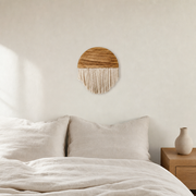 Arched Wood and Fringe Wall Hanging, 30 to 75 cm hung on the wall above a bed