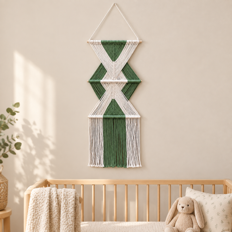 Nursery accent wall beside a cot, stacked hourglass tiers, twisted cord, short pale dowels