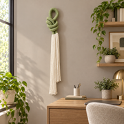 Home office above a desk, rope knot with a cream tassel, thick three-strand twisted rope, fine combed cord tassel