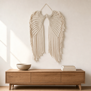 Macrame Angel Wings Wall Hanging, 68 x 44 cm hung on the wall above an oak sideboard