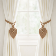 Macrame Leaf Curtain Tieback, 40 x 13 cm, 4 Colors holding back one of a pair of curtains at a window