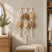 Three column hat rack holding six hats on a bedroom dressing wall