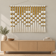 Living room above a console, bead grid and tassels, yarn-wrapped spheres, wrapped cord